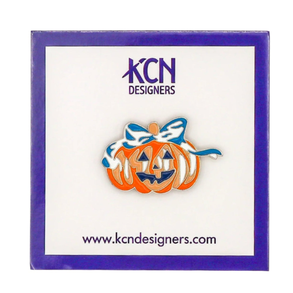 Pumpkin-shaped magnetic needle minder with a bow on a card featuring 'KCN Designers' branding.