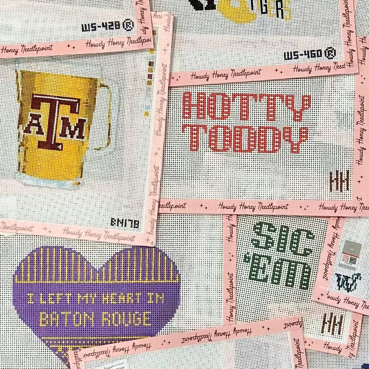 Collection of cross-stitched patterns with various designs and text on a pink background.