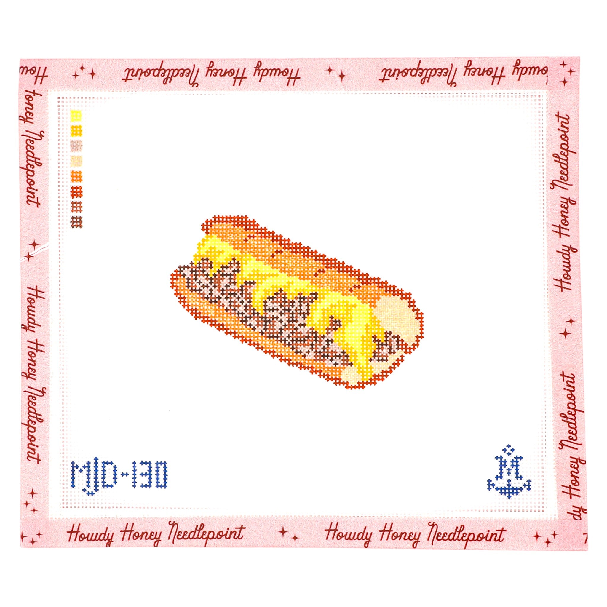 Hot dog with mustard on a bun within a cross-stitch pattern border.
