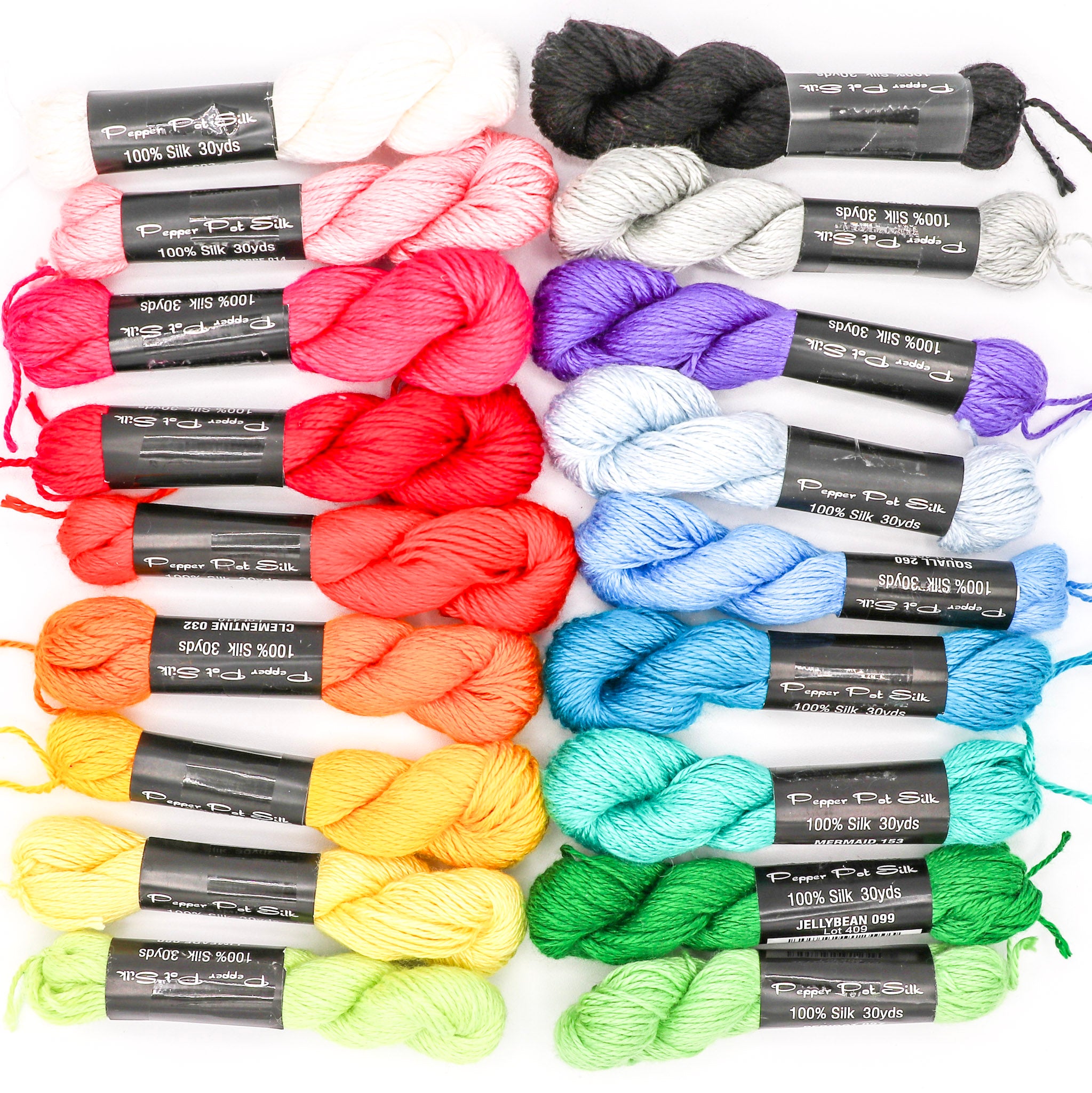 A collection of colorful Pepper Pot Silk yarn skeins arranged in a grid pattern.