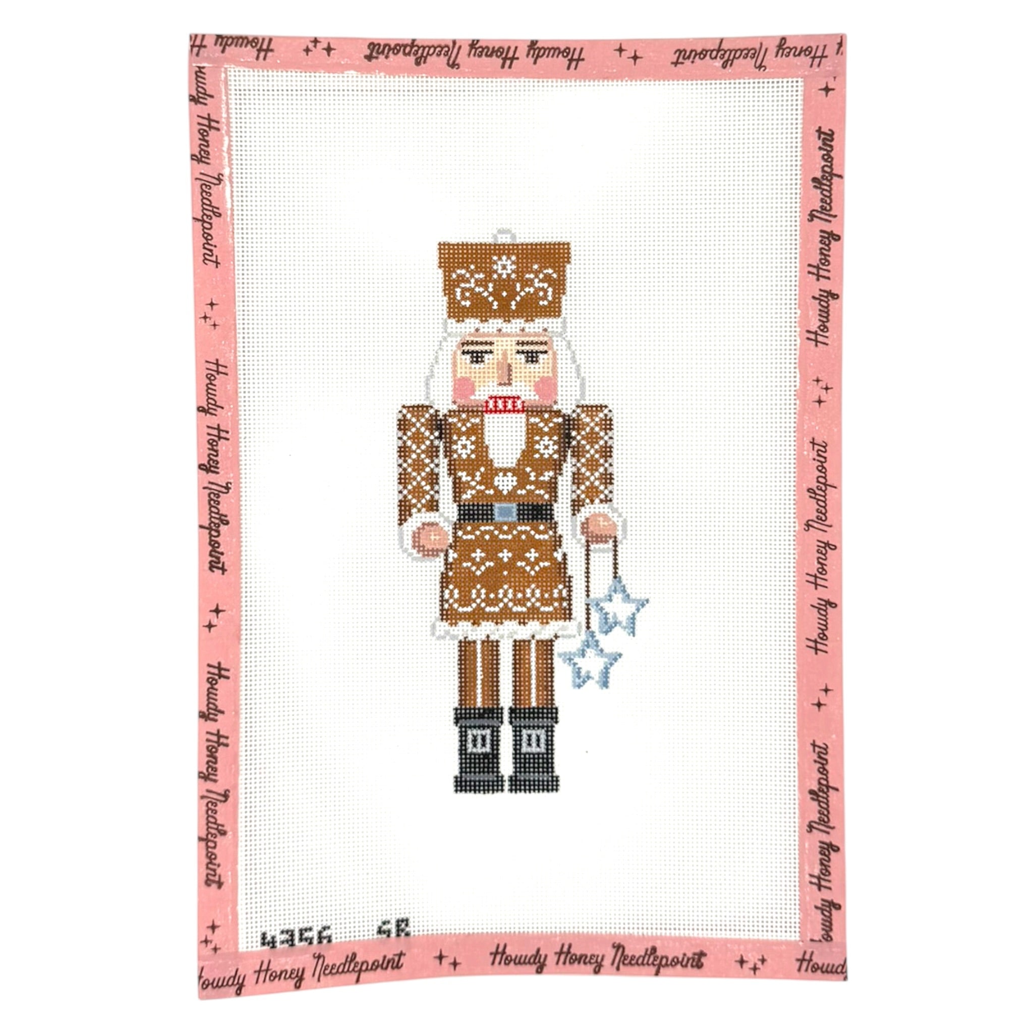 Cross-stitched nutcracker design on a white background with 'Heidi Hunny Needlepoint' branding.