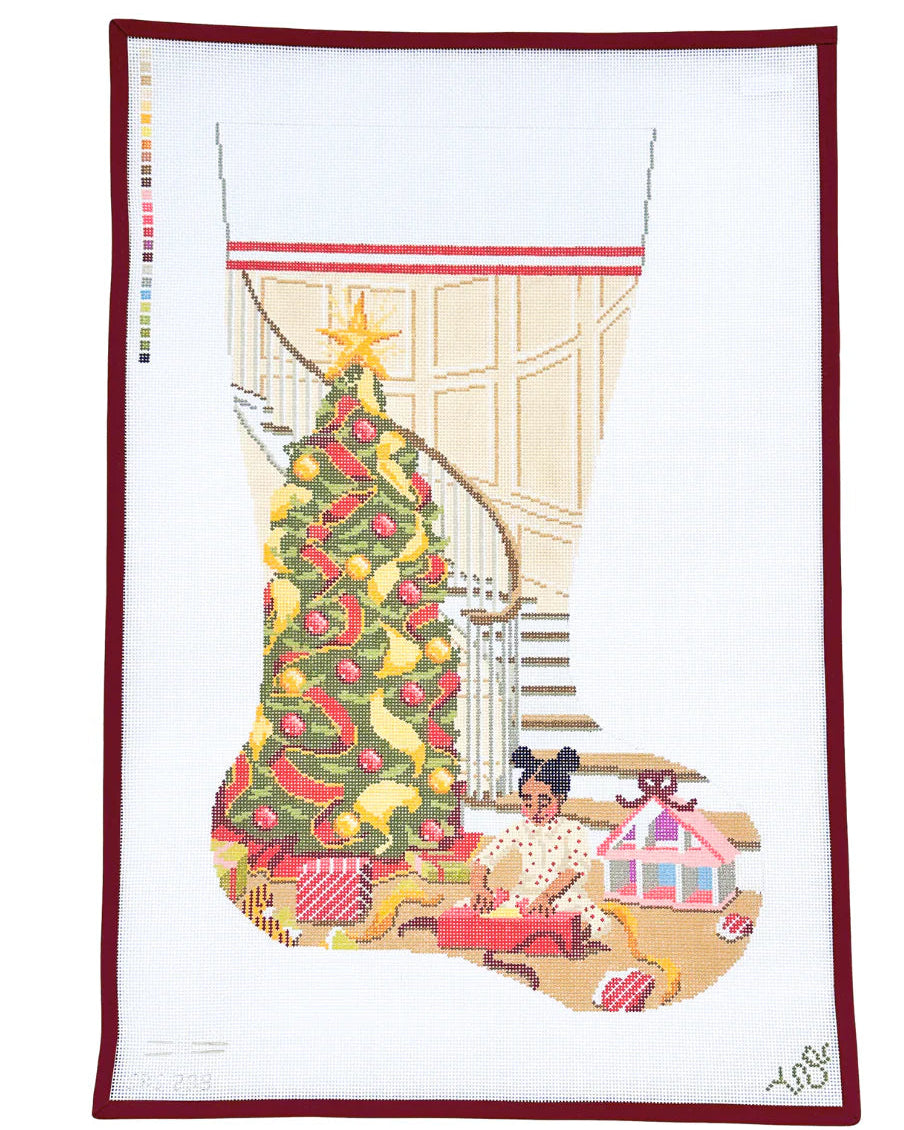 Decorative towel with a Christmas-themed design featuring a tree, presents, and a child.