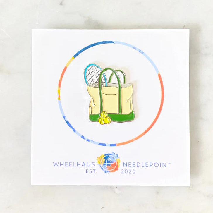 Card with a needlepoint design of a bag and tools, featuring Wheelhaus Needlepoint logo.
