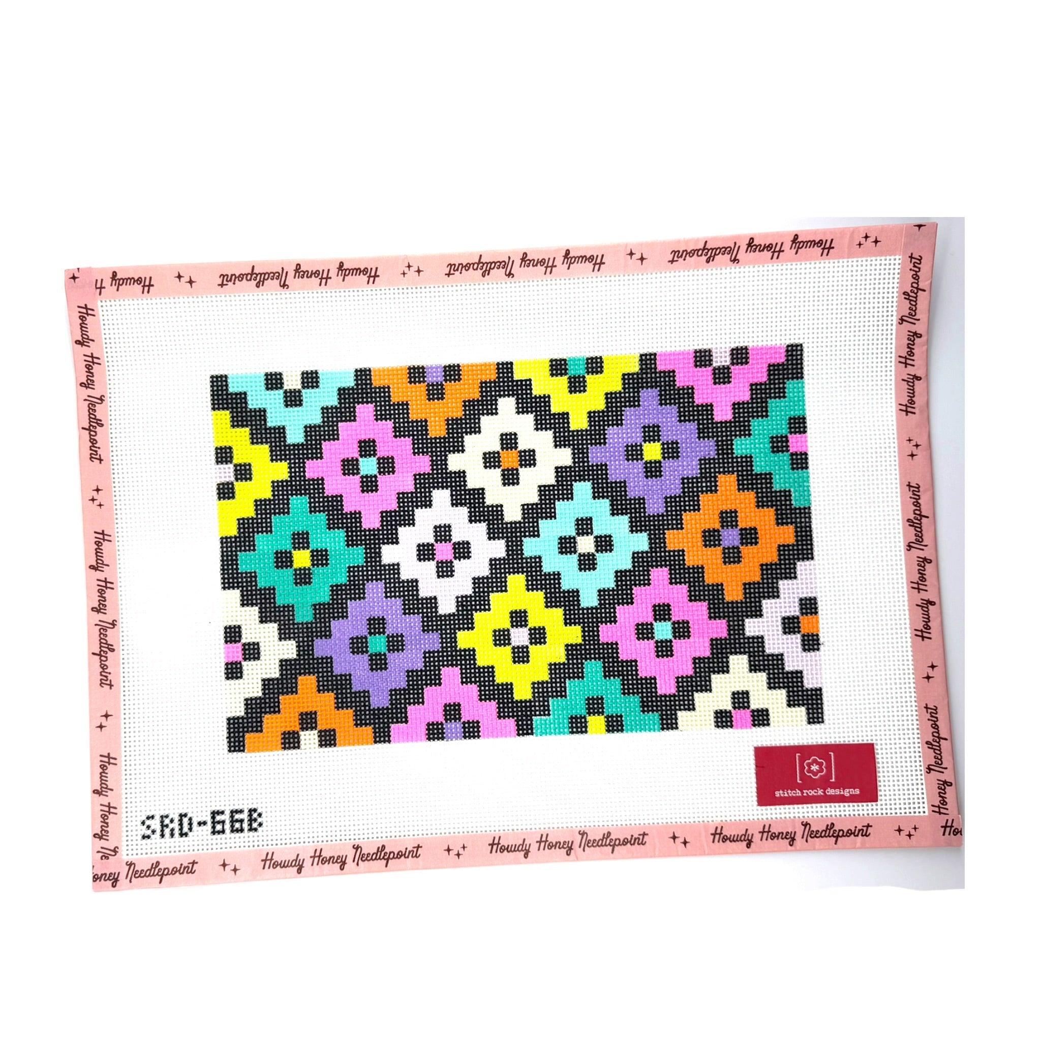 Colorful quilt with geometric pattern on a white background