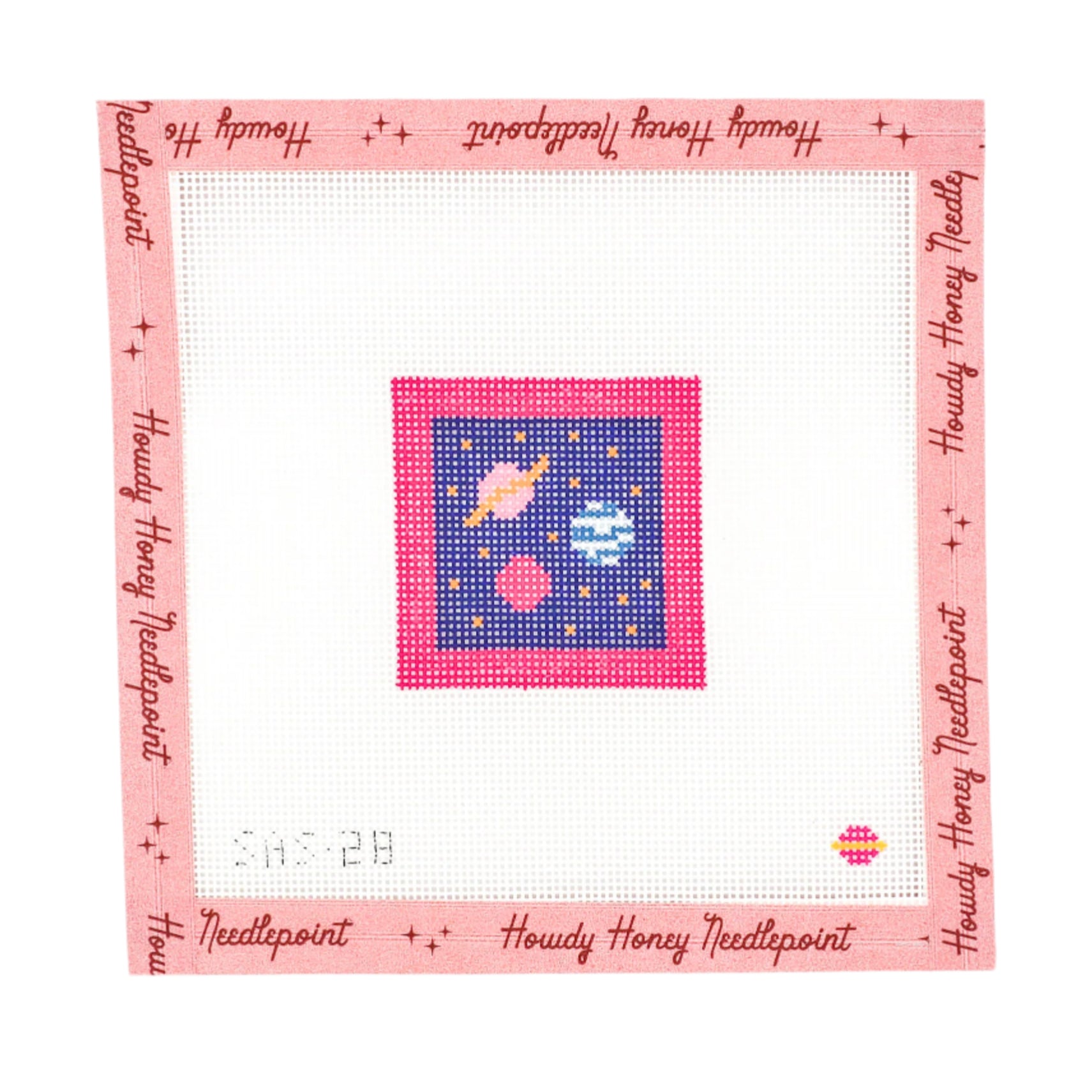 A 6x6 inch tapestry canvas with a space-themed design, including stars and planets, on a pink background. The canvas has a label with 'Saturnalia Stitching' branding and the product information.