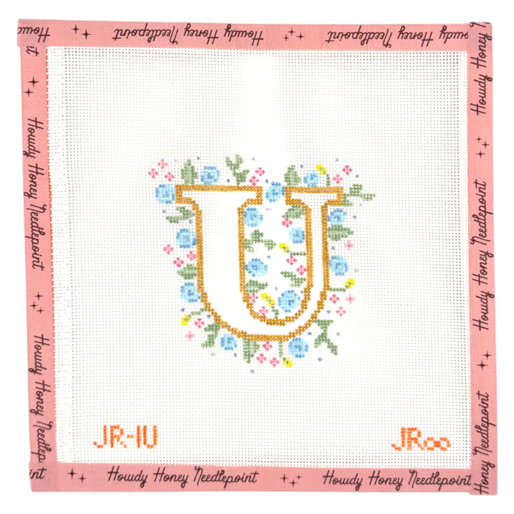 Cross-stitched letter 'U' with flowers on a white background, framed by pink border with 'Howdy Honey Needlepoint' text.