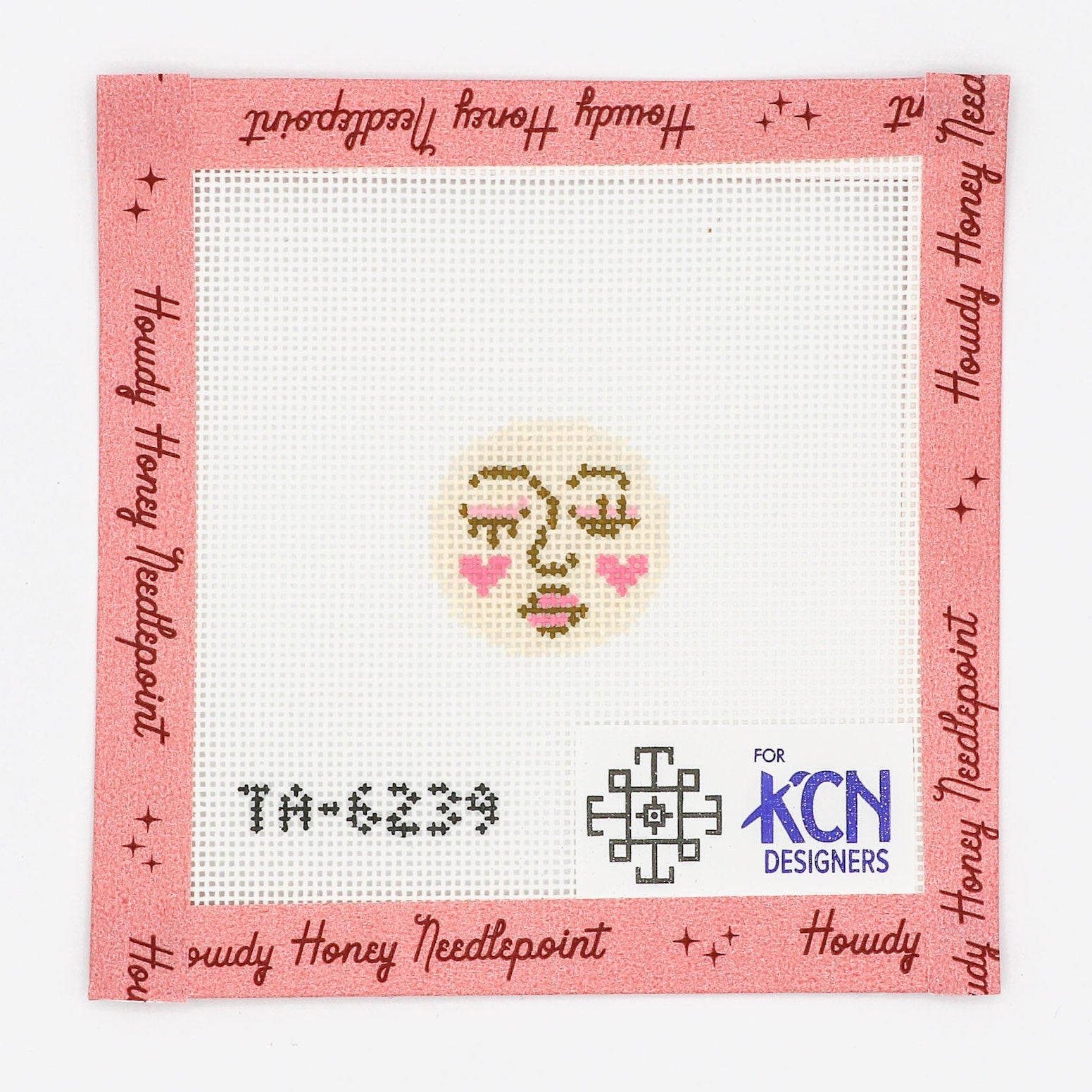 A tapestry needlepoint kit canvas with a design featuring a round piece with a face and a moon on it, labeled with 'TH-6238' and 'KCN Designers'.