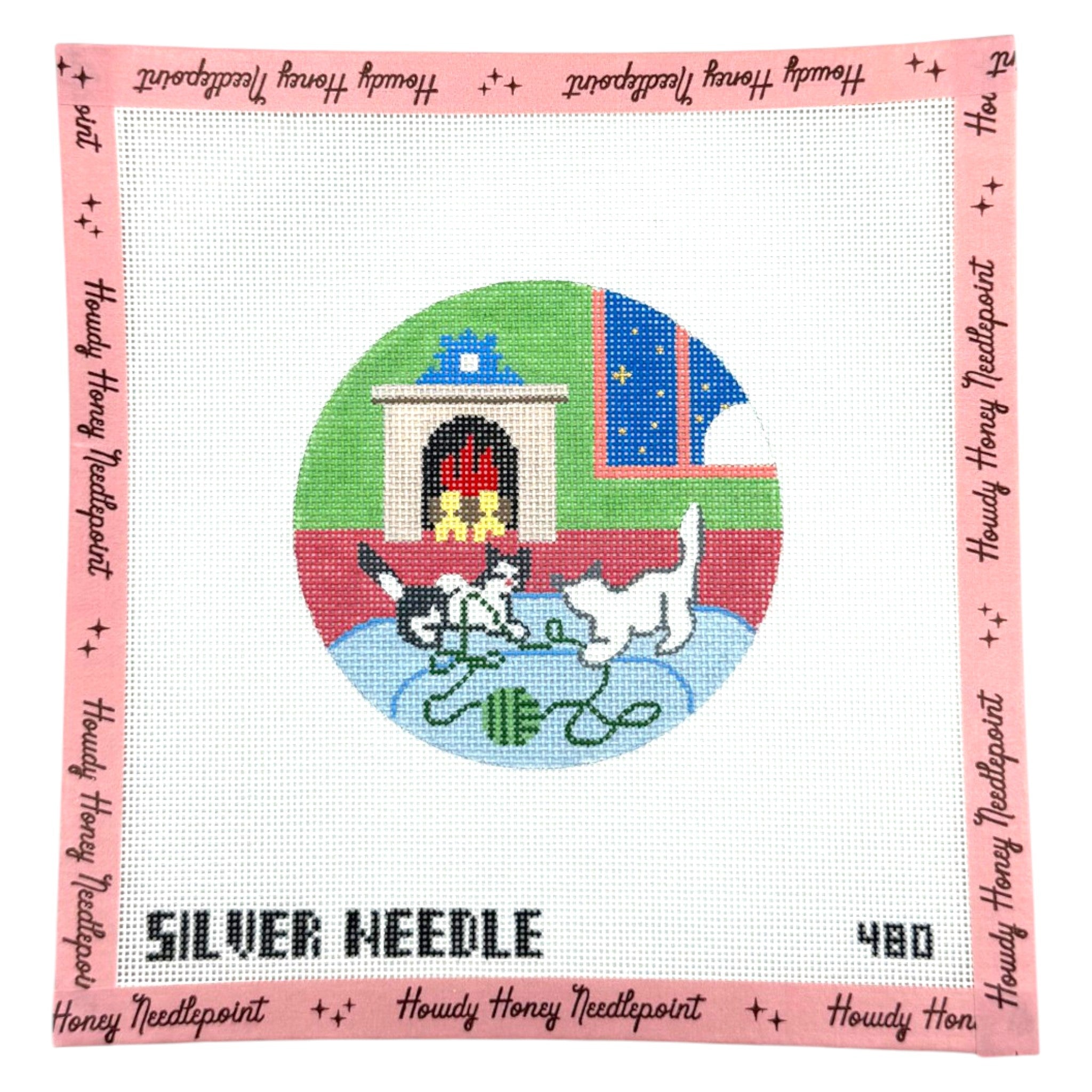 Cross-stitched design of two cats playing with a yarn ball, framed by 'Silver Needle' branding.