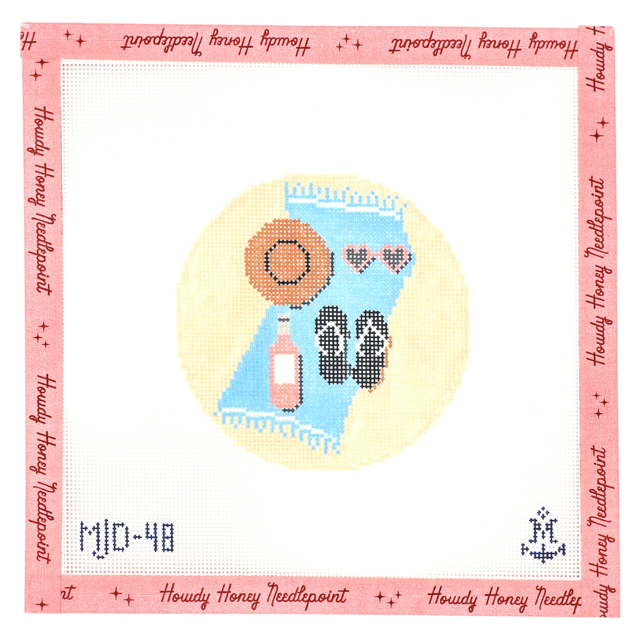 Needlepoint canvas with a design of a sun, flip-flops, and a bottle on a pink border with text.