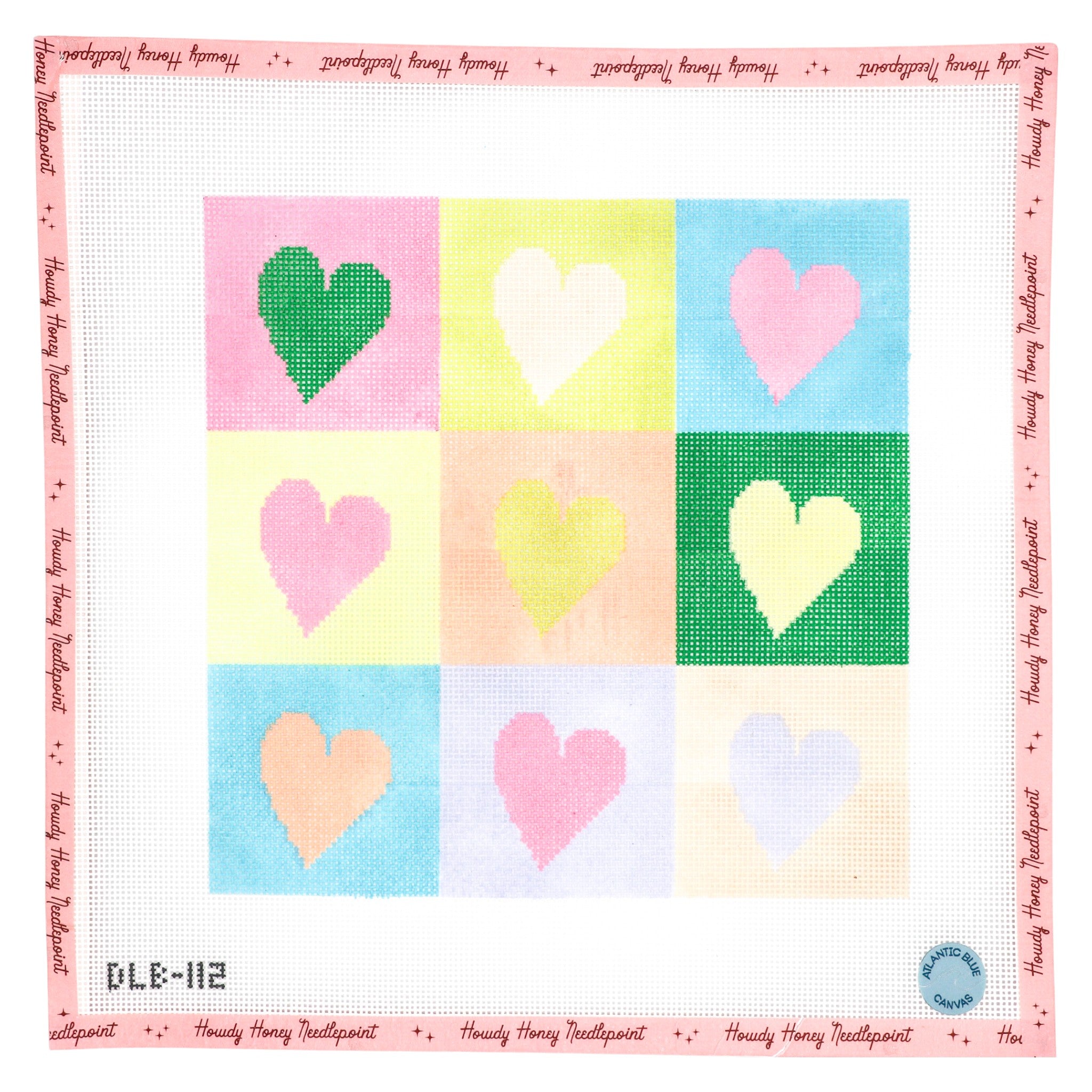 Patchwork quilt with colorful heart designs on a pink border
