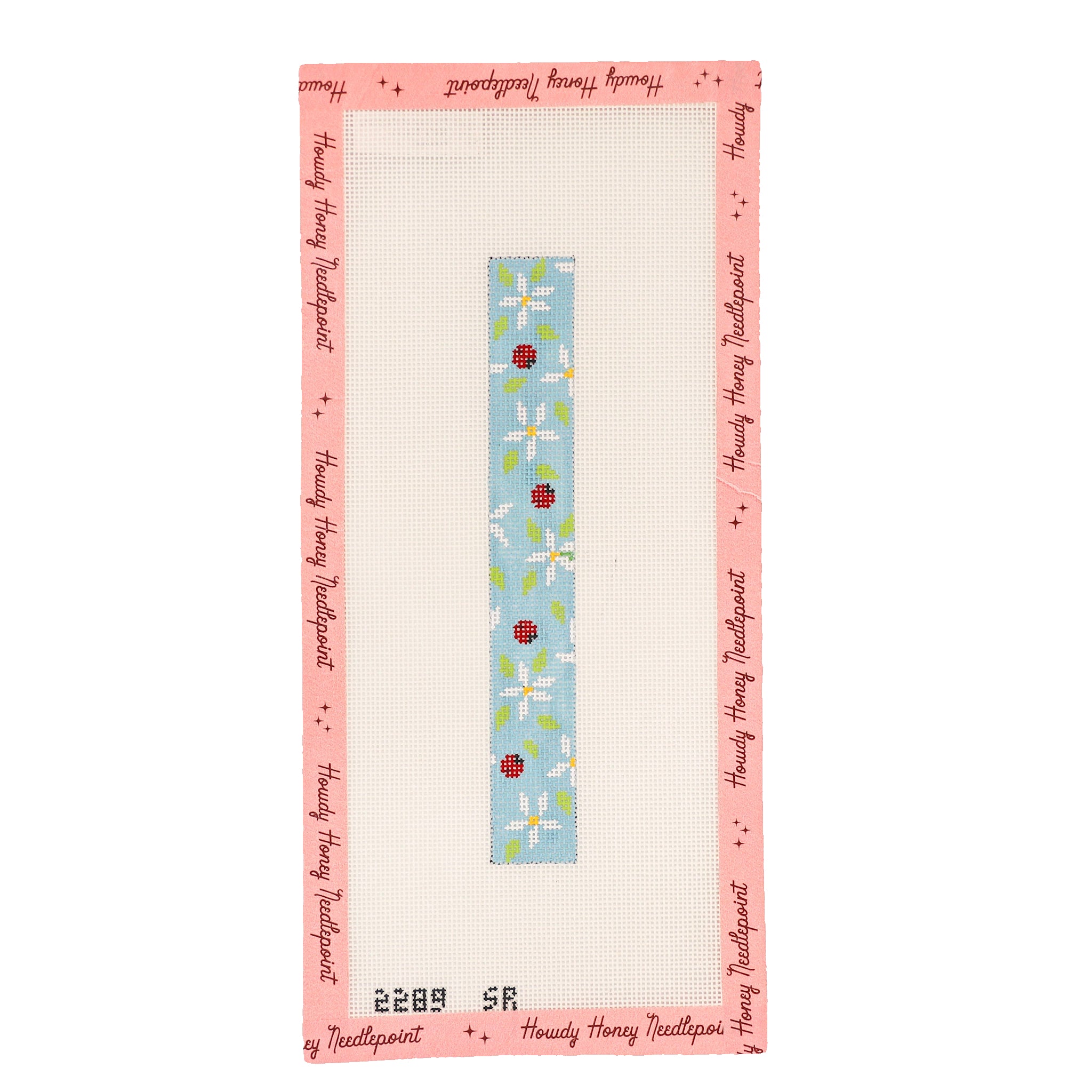 Needlepoint canvas with a floral design and border on a white background