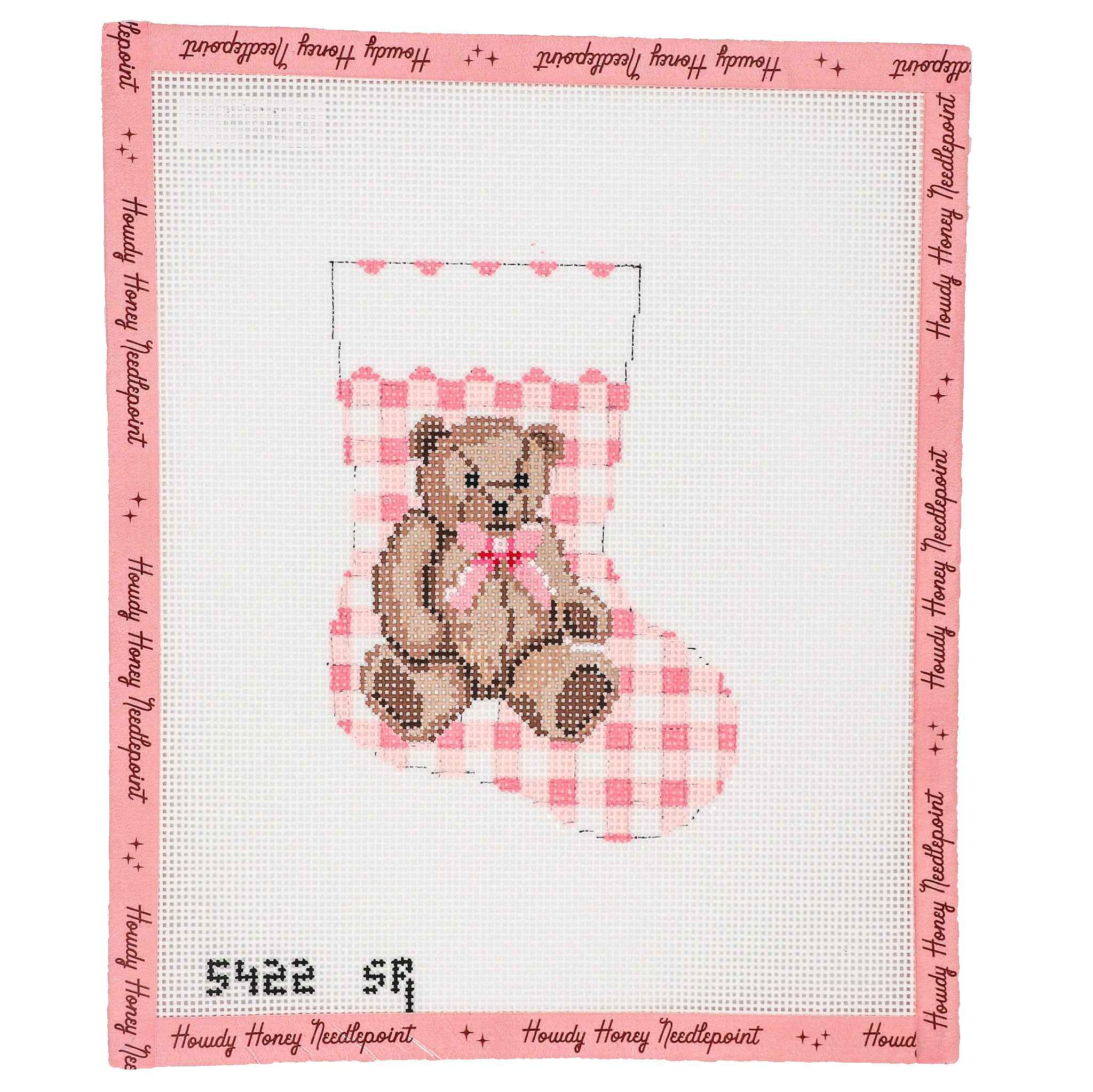 Cross-stitched design of a teddy bear in a stocking with a pink bow, on a white background with text border.