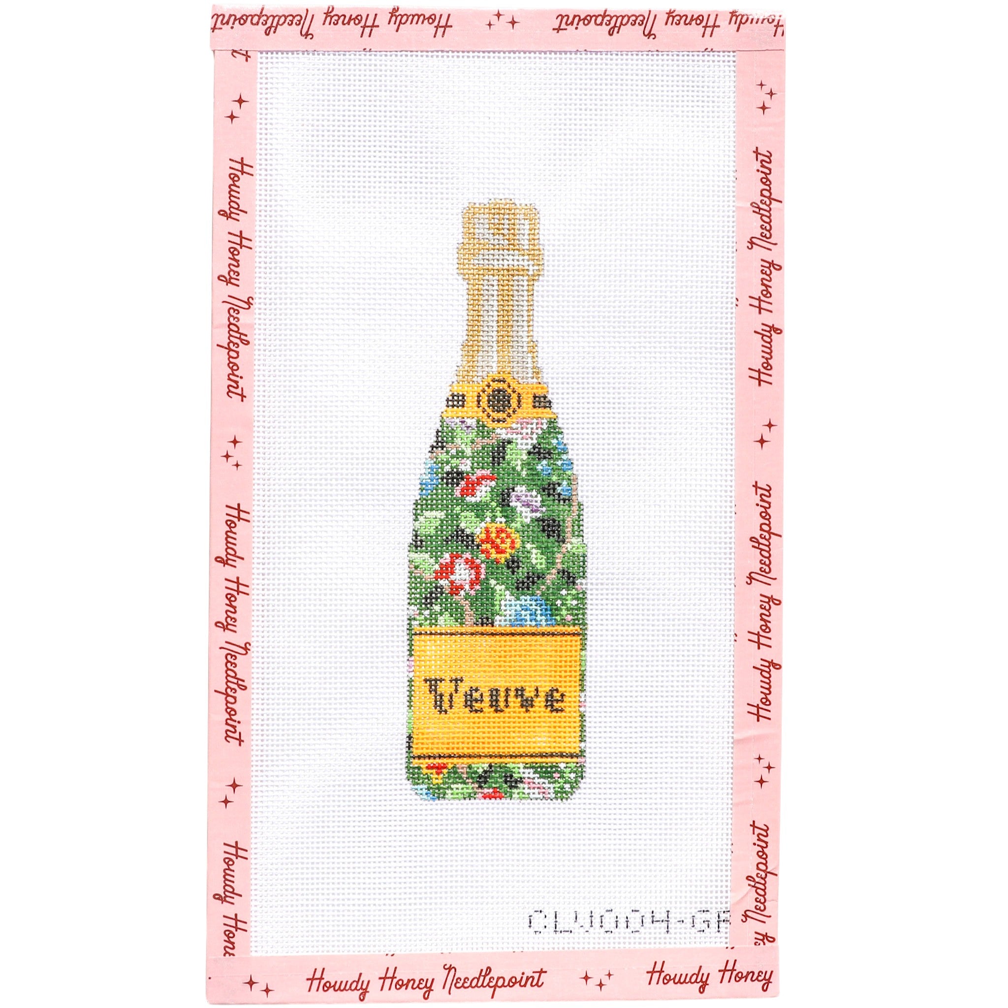 Cross-stitched design of a champagne bottle with floral label on pink background