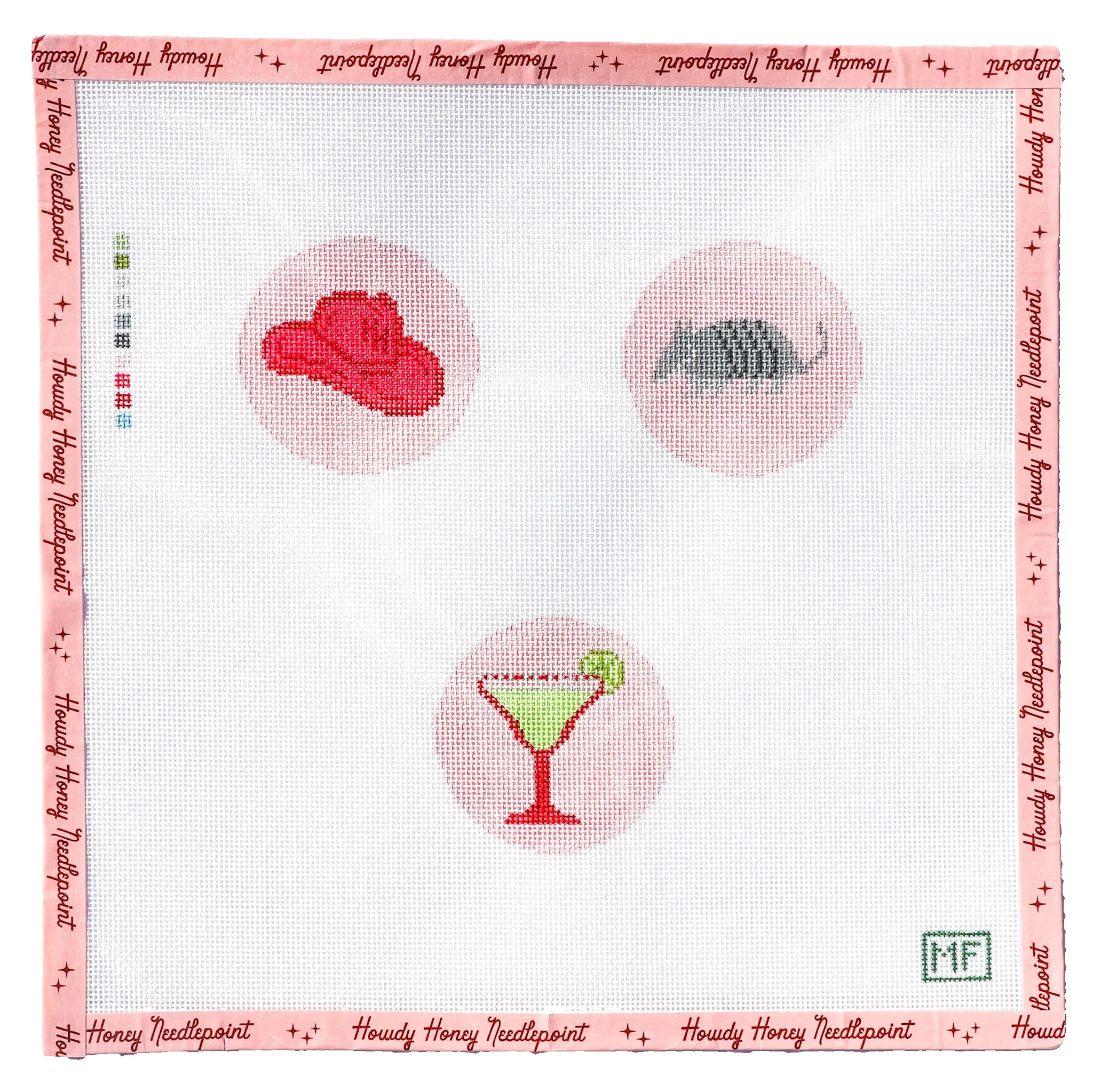 Cross-stitched design with a red hat, gray hedgehog, and green cocktail on a white fabric background.