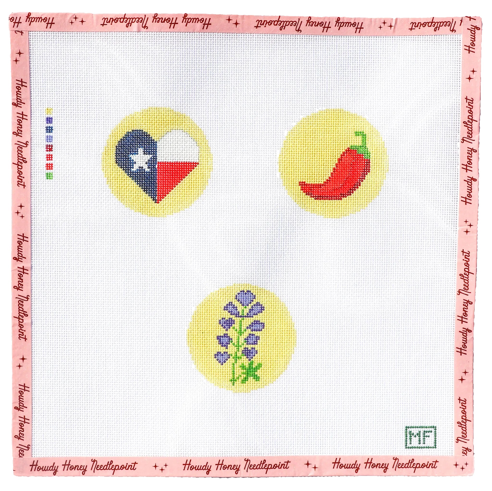 Needlepoint canvas with Texas flag, chili pepper, and flower designs on a pink border.