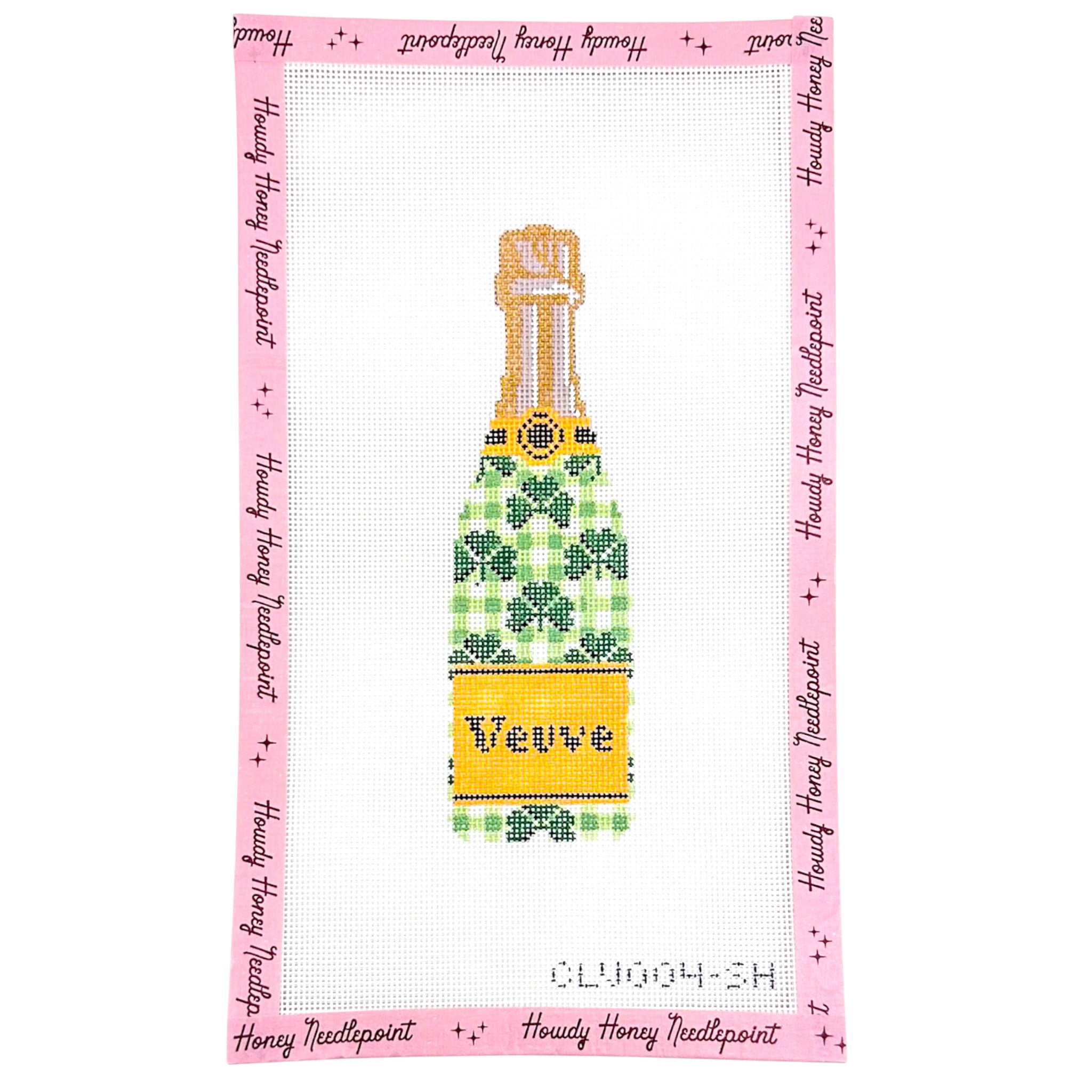 Cross-stitched pattern of a champagne bottle with a green and yellow design on a pink border with text.