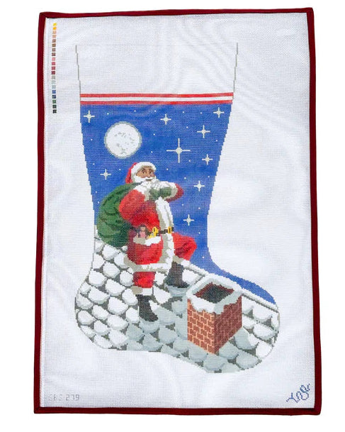 Decorative pillow with Santa Claus climbing a chimney design on a white background